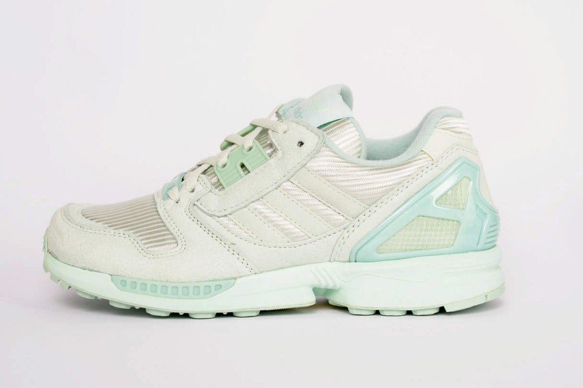 The Adidas ZX800s in a pastel green hue shown from a side-on angle. Here you can not only see the responsive midsole but also the breathable mesh that runs along the top.