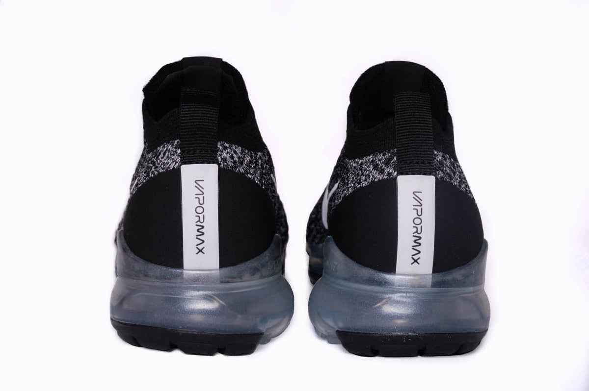 This image showcases the Nike Air VaporMax 3s from behind. Here you can find the VaporMax branding along the heel of the shoe.